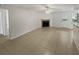 Living room with tile flooring, a fireplace and access to a patio at 5545 Devonbriar Way # I101, Orlando, FL 32822