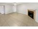 Living room features tile floors and a fireplace at 5545 Devonbriar Way # I101, Orlando, FL 32822