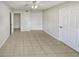 Spacious bedroom with tile flooring at 5545 Devonbriar Way # I101, Orlando, FL 32822