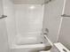 Bright bathroom with a bathtub and shower at 5545 Devonbriar Way # I101, Orlando, FL 32822