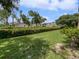 Community features lush green lawn and mature trees at 5545 Devonbriar Way # I101, Orlando, FL 32822