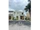 Two-story townhome with front porch and landscaping at 2444 Summerfield Way # 1, Kissimmee, FL 34741