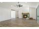 Spacious living area with a stone fireplace and vaulted ceilings at 19906 Eldorado Dr, Eustis, FL 32736