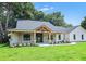 All-brick home with a welcoming front porch and attached two-car garage at 19906 Eldorado Dr, Eustis, FL 32736