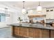 Modern kitchen with a large island, stainless steel appliances and custom cabinets at 19906 Eldorado Dr, Eustis, FL 32736