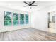 Bright and spacious bedroom with hardwood floors and large windows at 19906 Eldorado Dr, Eustis, FL 32736