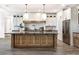 Modern kitchen with a large island, stainless steel appliances and custom cabinets at 19906 Eldorado Dr, Eustis, FL 32736