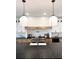 Spacious kitchen island with dark countertops and modern lighting at 19906 Eldorado Dr, Eustis, FL 32736