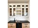 Kitchen wet bar with glass-front cabinets and dark countertops at 19906 Eldorado Dr, Eustis, FL 32736