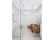 Spa-like bathroom with a copper tub and glass shower at 19906 Eldorado Dr, Eustis, FL 32736
