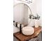 Modern bathroom with a unique vessel sink and a large round mirror at 19906 Eldorado Dr, Eustis, FL 32736