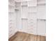 Spacious walk-in closet with ample shelving and drawers at 19906 Eldorado Dr, Eustis, FL 32736