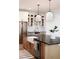 Modern kitchen with a farmhouse sink, stainless steel appliances and custom cabinets at 19906 Eldorado Dr, Eustis, FL 32736