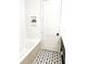Bathroom with herringbone tile, built-in shelves, and modern tub at 19906 Eldorado Dr, Eustis, FL 32736
