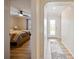 Hallway with view into bedroom and entryway with patterned rug at 342 Maple Dr, Longwood, FL 32750