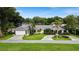 House with a large front yard and circular driveway at 342 Maple Dr, Longwood, FL 32750