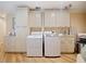 Updated laundry room with new washer, dryer, and custom cabinetry at 342 Maple Dr, Longwood, FL 32750