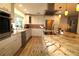 Bright kitchen with stainless steel appliances, granite countertops, and updated cabinetry at 342 Maple Dr, Longwood, FL 32750