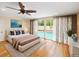 Main bedroom with sliding glass doors opening to the pool at 342 Maple Dr, Longwood, FL 32750