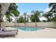 Inviting kidney shaped pool with lounge chairs at 342 Maple Dr, Longwood, FL 32750