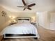 Spacious Primary bedroom with hardwood floors, ceiling fan, and ample natural light at 342 Maple Dr, Longwood, FL 32750