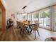 Elegant dining room with a long live-edge wood table and modern chairs at 342 Maple Dr, Longwood, FL 32750