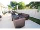 Spacious patio with wicker furniture and umbrella, great for relaxing at 342 Maple Dr, Longwood, FL 32750