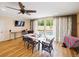 Casual dining area with sliding doors leading to the pool at 342 Maple Dr, Longwood, FL 32750