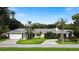 Single-Gathering home with a two-car garage and circular driveway at 342 Maple Dr, Longwood, FL 32750