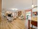 Spacious living room with stone fireplace, hardwood floors, and ample natural light at 342 Maple Dr, Longwood, FL 32750