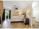 Main bedroom with hardwood floors, ceiling fan, and large walk-in closet at 342 Maple Dr, Longwood, FL 32750