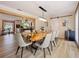 Elegant dining room with a long live-edge wood table and modern chairs at 342 Maple Dr, Longwood, FL 32750