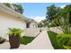 Artificial turf and walkway leading to a fenced pool area at 342 Maple Dr, Longwood, FL 32750