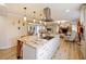 Open concept kitchen with large island, stainless steel appliances, and hardwood floors at 342 Maple Dr, Longwood, FL 32750