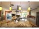 Modern kitchen with large island, granite countertops, and stainless steel appliances at 342 Maple Dr, Longwood, FL 32750