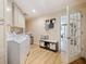 Bright laundry room with washer, dryer, and ample cabinet space at 342 Maple Dr, Longwood, FL 32750