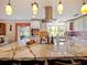 Gourmet kitchen with expansive island, stainless steel appliances, and granite countertops at 342 Maple Dr, Longwood, FL 32750