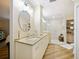 Updated bathroom features a walk-in shower, granite countertops, and modern vanity at 342 Maple Dr, Longwood, FL 32750