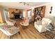 Living room with fireplace, hardwood floors, and comfortable seating at 342 Maple Dr, Longwood, FL 32750