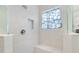 Large walk-in shower with a built-in seat and tiled walls at 1282 Zeek Ridge St, Clermont, FL 34715