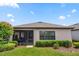 Screened-in porch and neatly landscaped backyard at 1282 Zeek Ridge St, Clermont, FL 34715