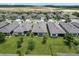 Aerial view of houses with gray roofs and green lawns at 1282 Zeek Ridge St, Clermont, FL 34715