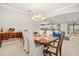 Open concept dining area with view into the kitchen and living room at 1282 Zeek Ridge St, Clermont, FL 34715