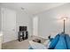 Cozy bonus room features a comfy couch and flat-screen TV at 1282 Zeek Ridge St, Clermont, FL 34715