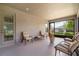 Relaxing screened porch with comfy seating at 1282 Zeek Ridge St, Clermont, FL 34715