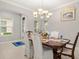 Elegant dining room with a formal table and chandelier at 1282 Zeek Ridge St, Clermont, FL 34715