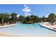 Relaxing lazy river style pool with ample lounge chairs at 4036 Oakrise Loop, Davenport, FL 33837