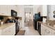Kitchen with granite countertops and stainless steel appliances at 4036 Oakrise Loop, Davenport, FL 33837