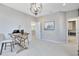 Home office featuring a rustic writing desk and a stylish light fixture at 12863 Upper Harden Ave, Orlando, FL 32827