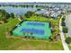 Aerial view of two tennis courts in a community setting at 12863 Upper Harden Ave, Orlando, FL 32827